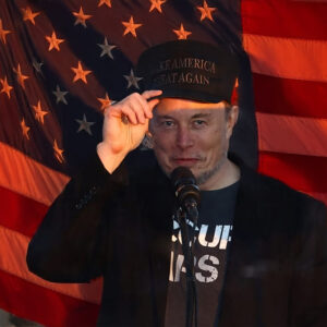 Dark MAGA Hat Elon Musk rallies onstage with Trump in Pennsylvania USA